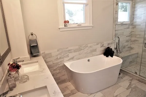 a white bath tub sitting in a bathroom
