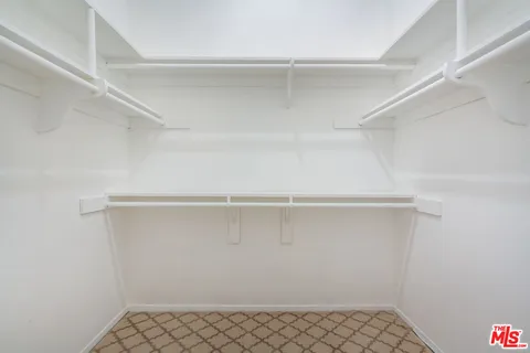 a view of an empty walk in closet