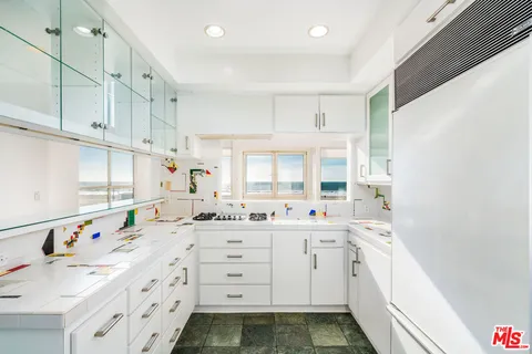 a room with a sink and a window