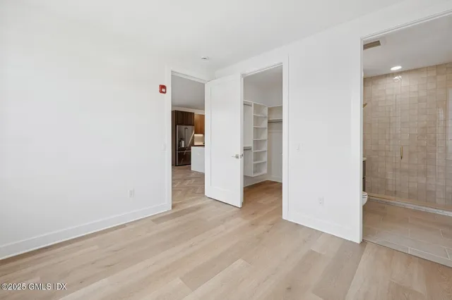 an empty room with wooden floor