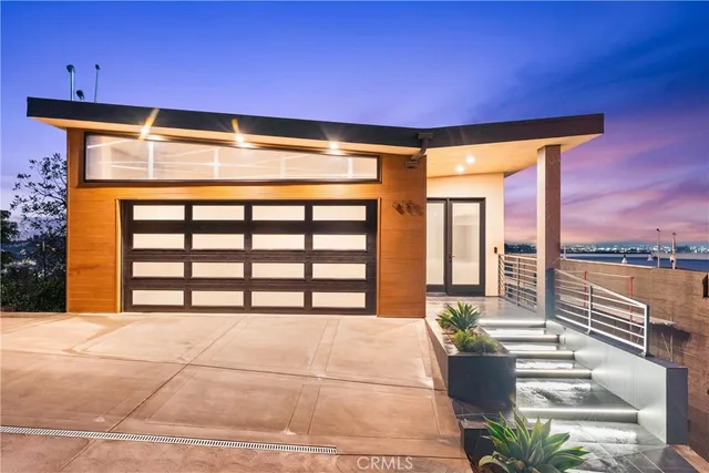 a front view of a house with a ocean view