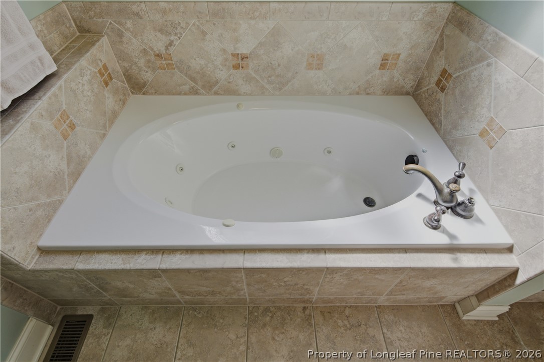 14 Spring Water Court Spring Lake, NC 28390 - Photo 13 of 34 a bathroom with a bathtub