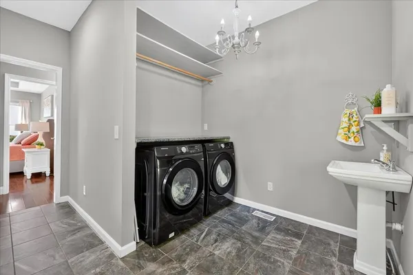 a kitchen with a stove sink and cabinets