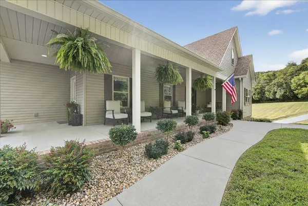 a view of a chair and table in the balcony