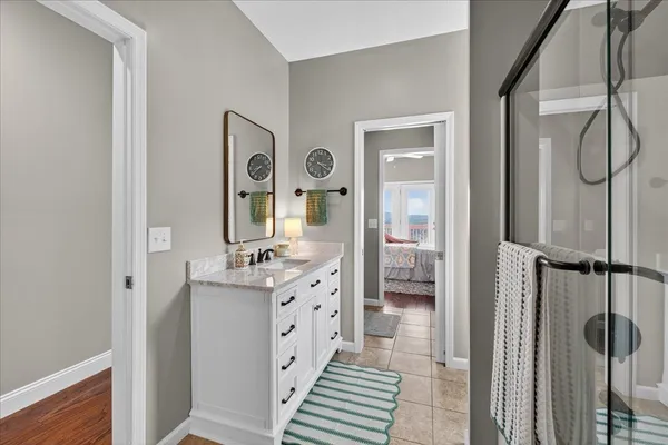 an empty room with furniture and a ceiling fan