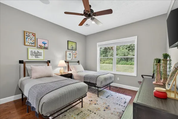 a view of a roof deck with couches and wooden floor