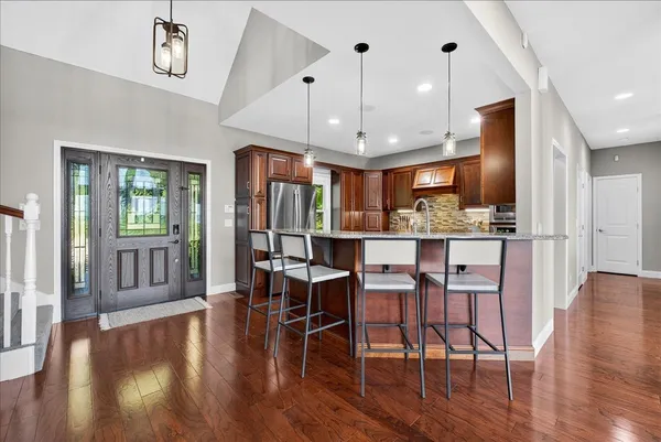 a storage room with granite countertop lots of different kinds of food