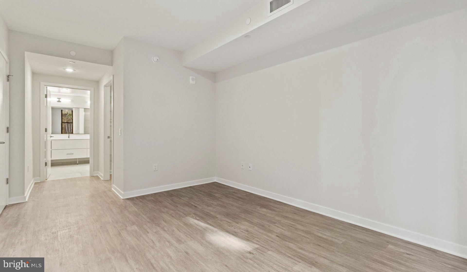 4000 Wisconsin Avenue Northwest, Unit 4K236 Washington, DC 20016 - Photo 33 of 54 wooden floor in an empty room