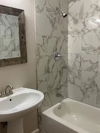 a bathroom with a sink and mirror