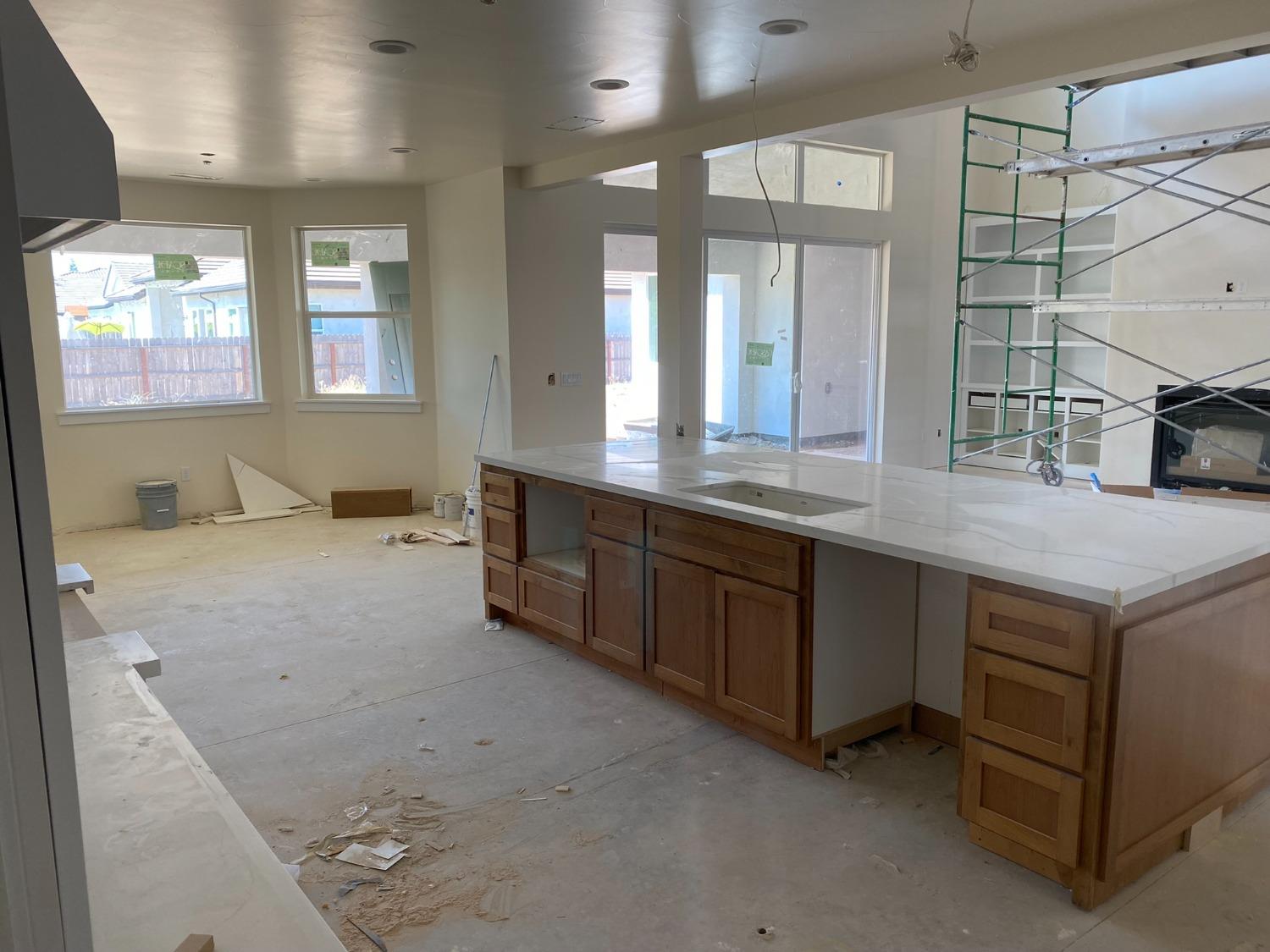 3076 Lester Avenue Clovis, CA 93619 - Photo 11 of 47 a bathroom with a granite countertop sink and a mirror