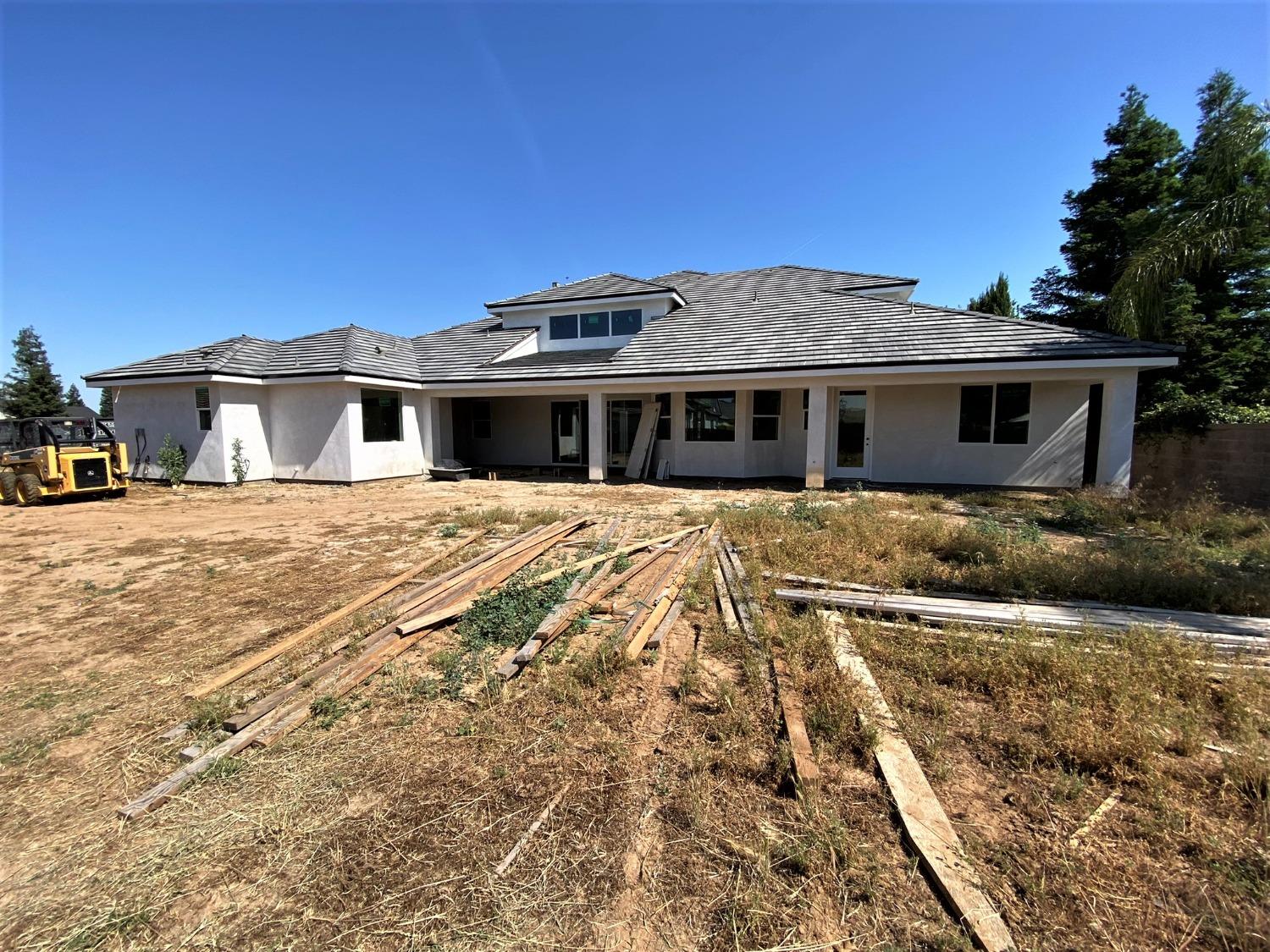 3076 Lester Avenue Clovis, CA 93619 - Photo 2 of 47 a view of a house with a yard