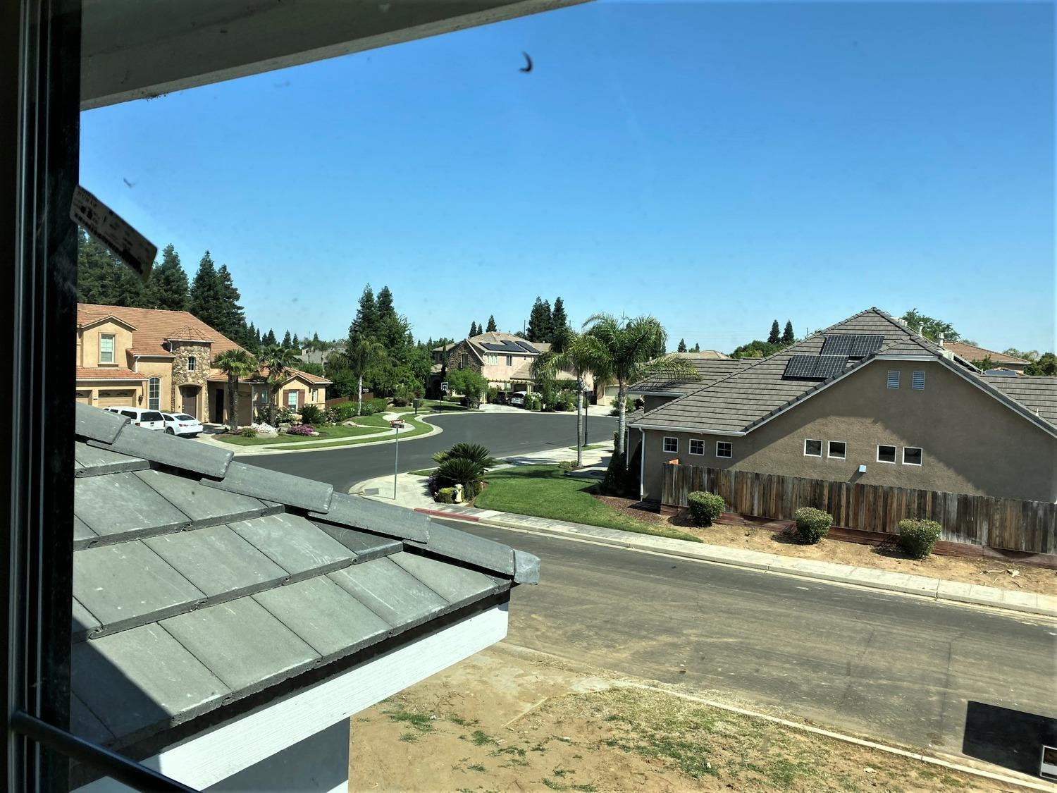 3076 Lester Avenue Clovis, CA 93619 - Photo 28 of 47 a view of a house with a yard