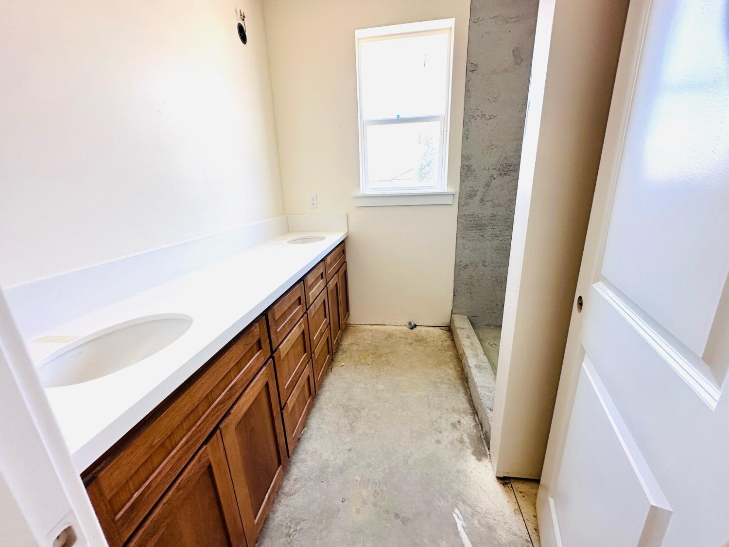 3076 Lester Avenue Clovis, CA 93619 - Photo 33 of 47 a view of a hallway with wooden floor and stairs