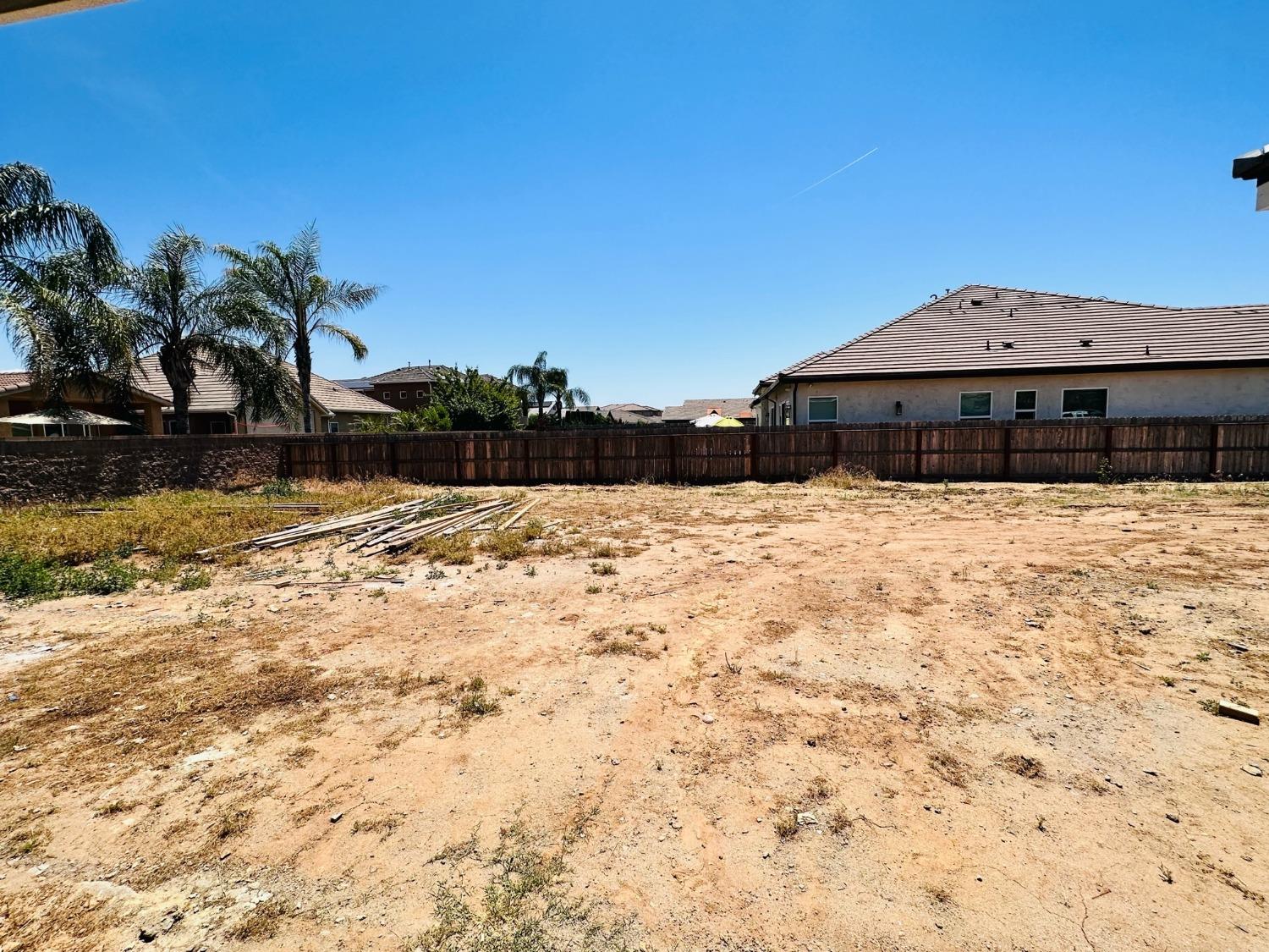 3076 Lester Avenue Clovis, CA 93619 - Photo 43 of 47 a view of house with snow on the road