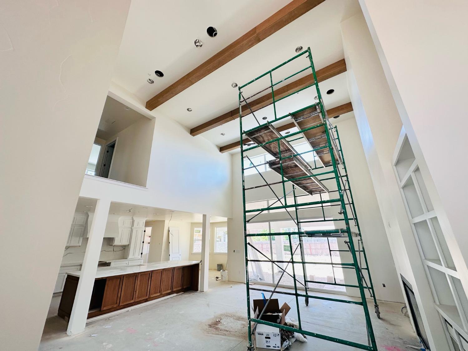 3076 Lester Avenue Clovis, CA 93619 - Photo 5 of 47 a view of staircase with white walls and wooden floor