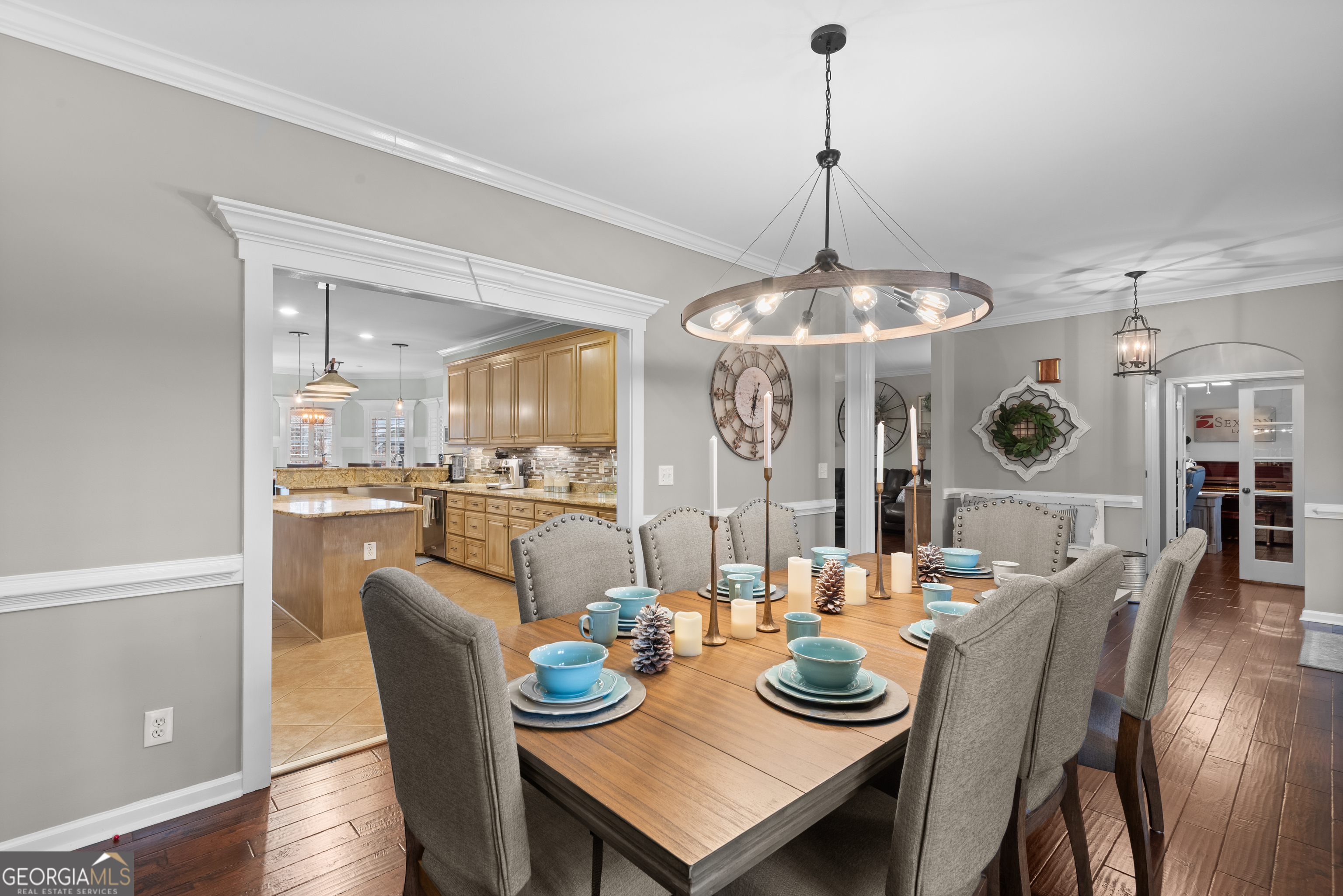 414 Parker Branch Road Barnesville, GA 30204 - Photo 19 of 101 a dining room with furniture a chandelier and wooden floor
