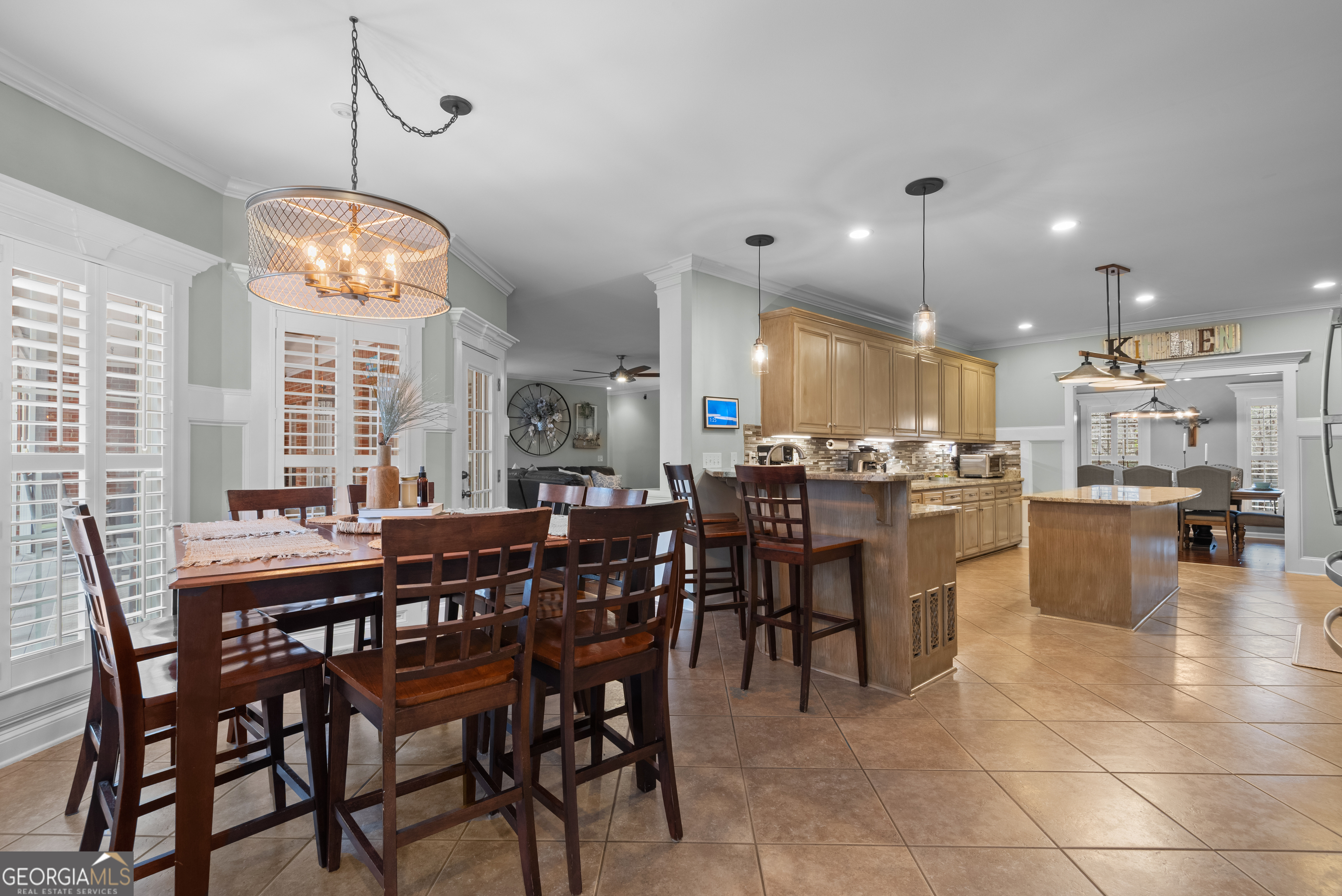 414 Parker Branch Road Barnesville, GA 30204 - Photo 27 of 101 a dining area with stainless steel appliances kitchen island granite countertop a table chairs and a view of living room