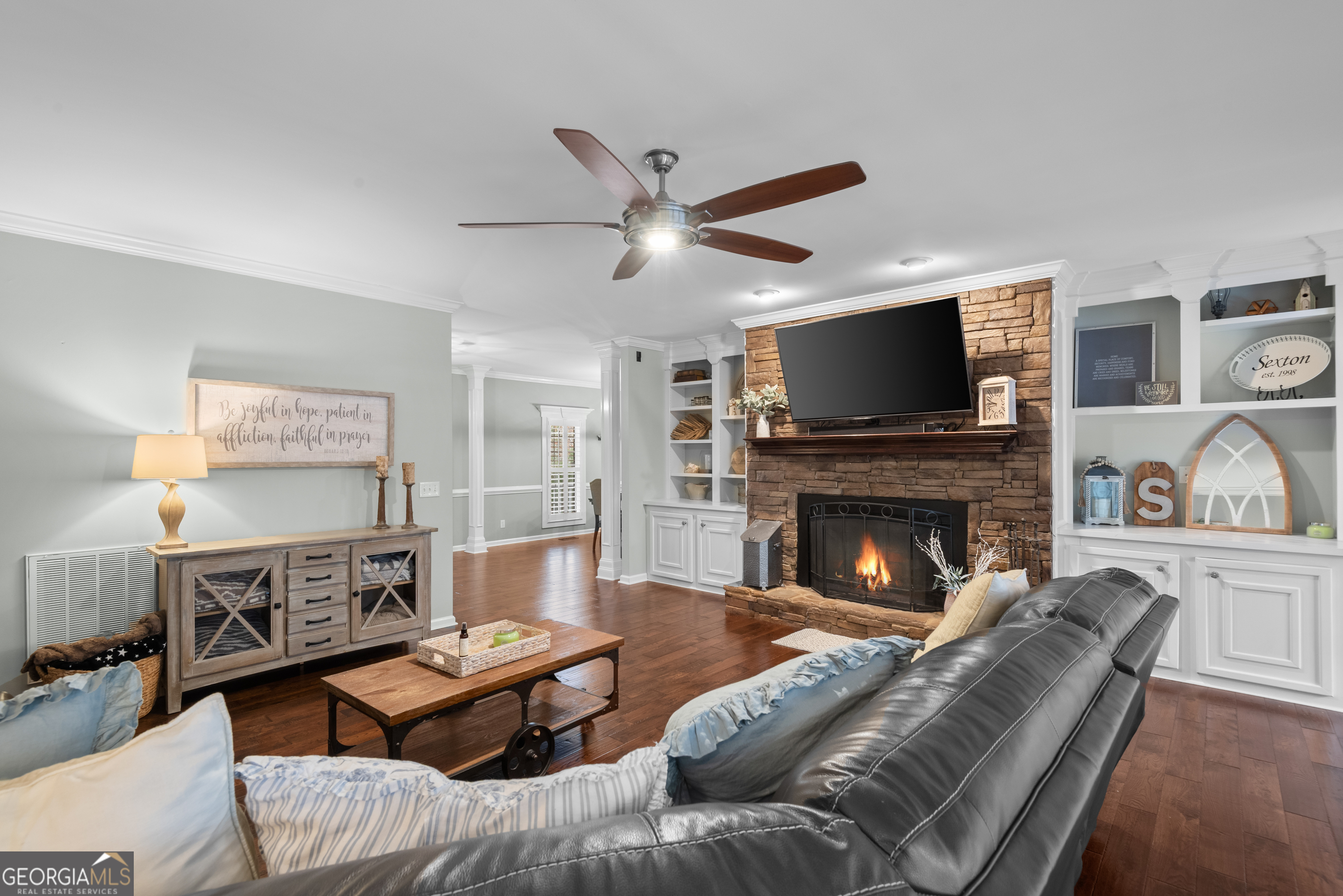 414 Parker Branch Road Barnesville, GA 30204 - Photo 32 of 101 a living room with furniture a fireplace and a flat screen tv