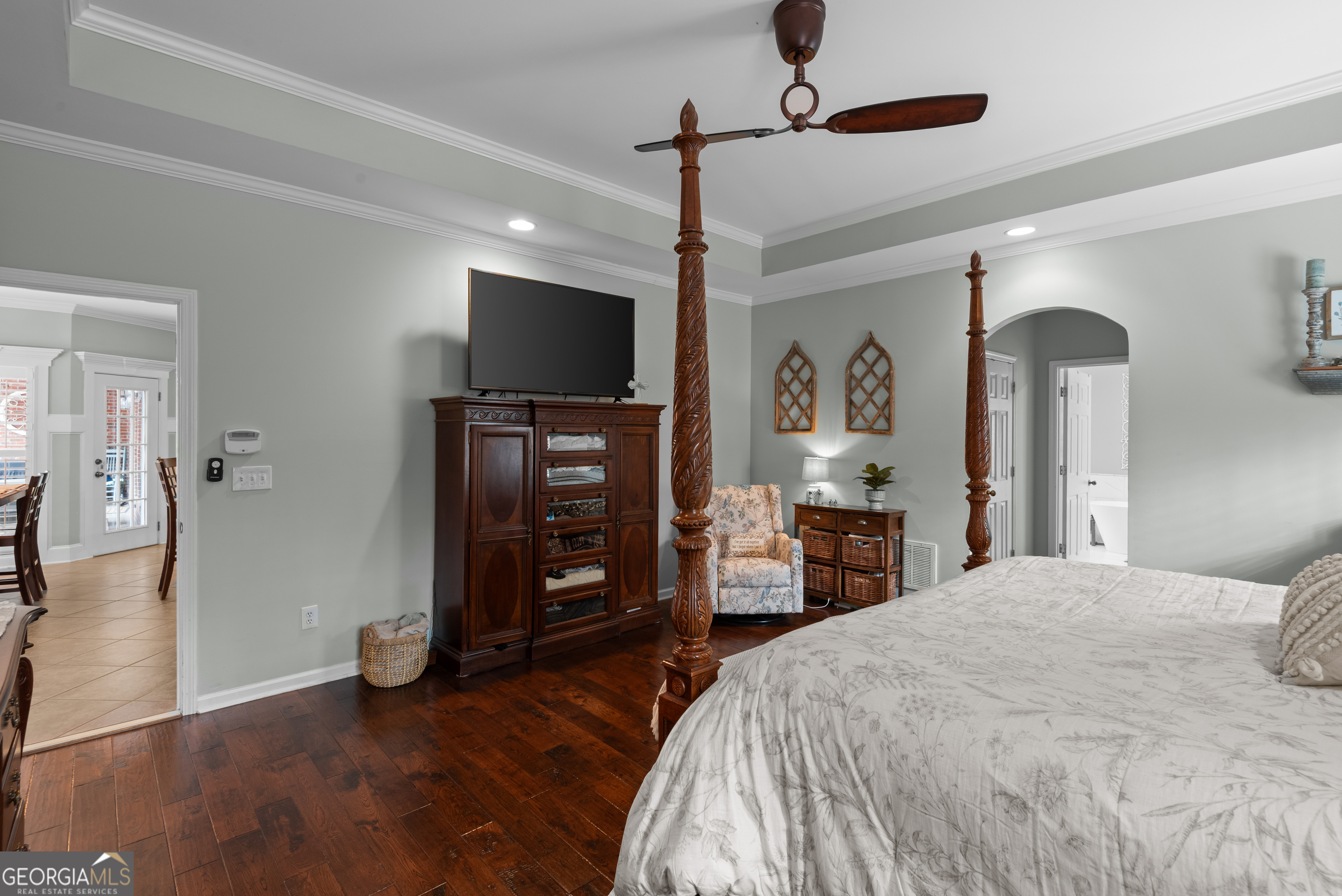 414 Parker Branch Road Barnesville, GA 30204 - Photo 38 of 101 a spacious bedroom with a bed and a flat screen tv