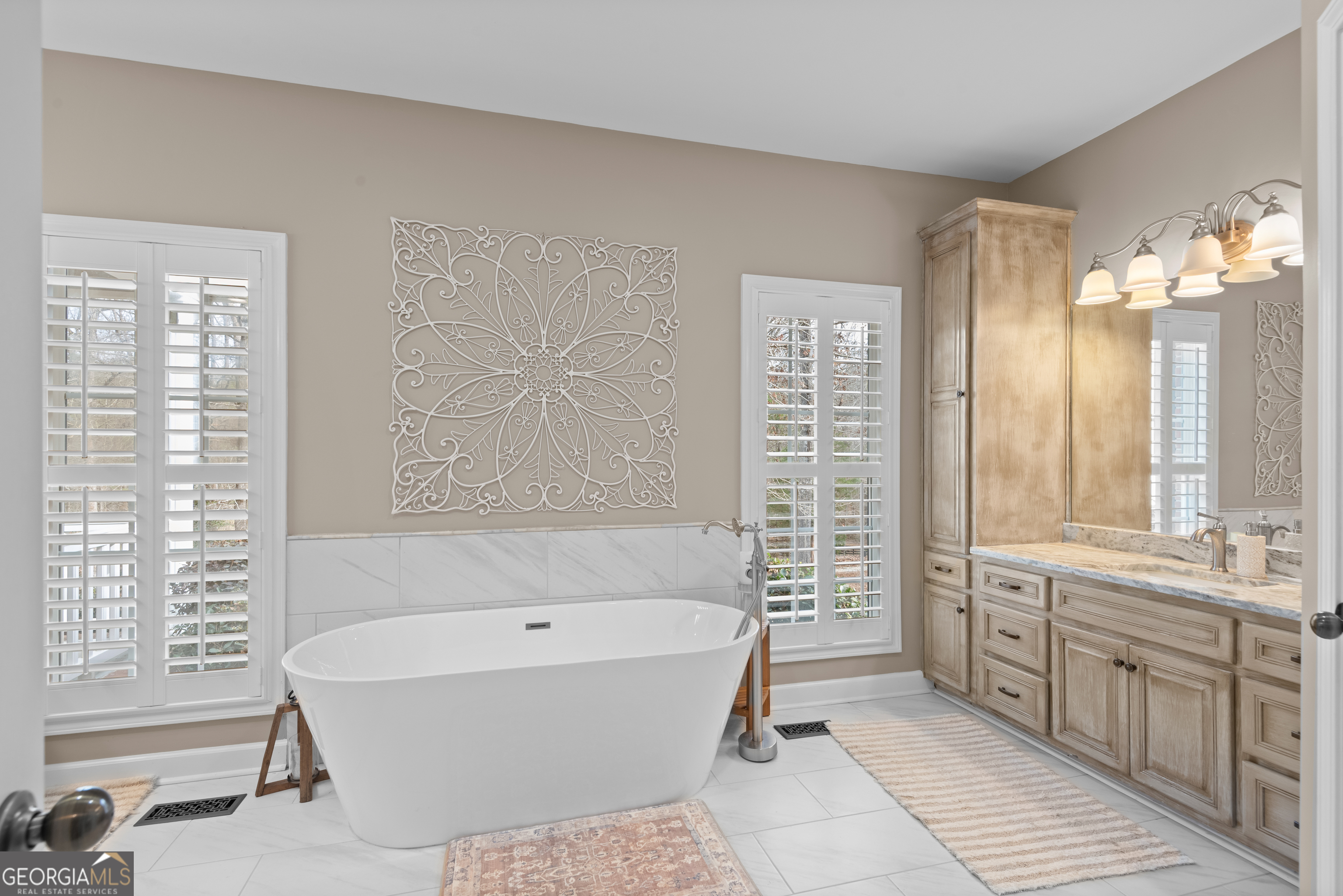 414 Parker Branch Road Barnesville, GA 30204 - Photo 39 of 101 a bathroom with a bathtub a double vanity sink and a shower