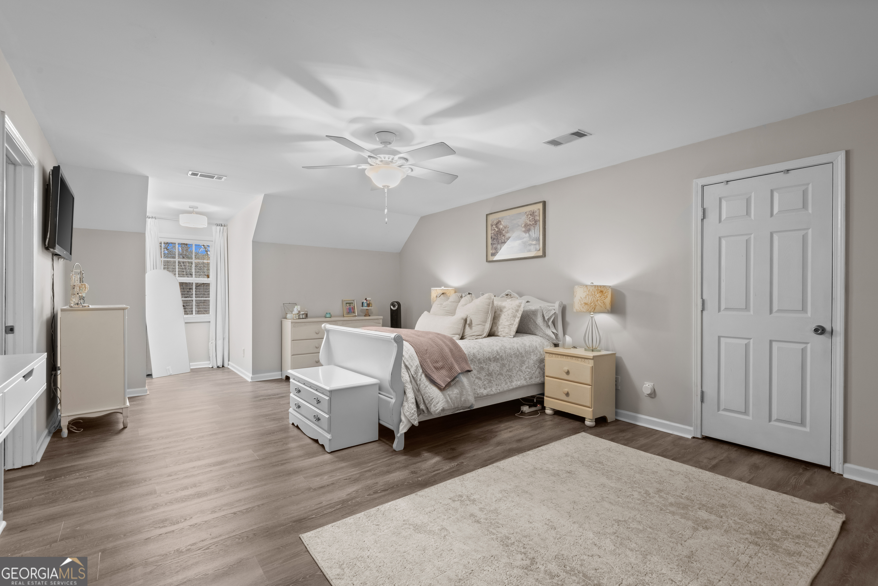 414 Parker Branch Road Barnesville, GA 30204 - Photo 55 of 101 a spacious bedroom with a bed and a couch