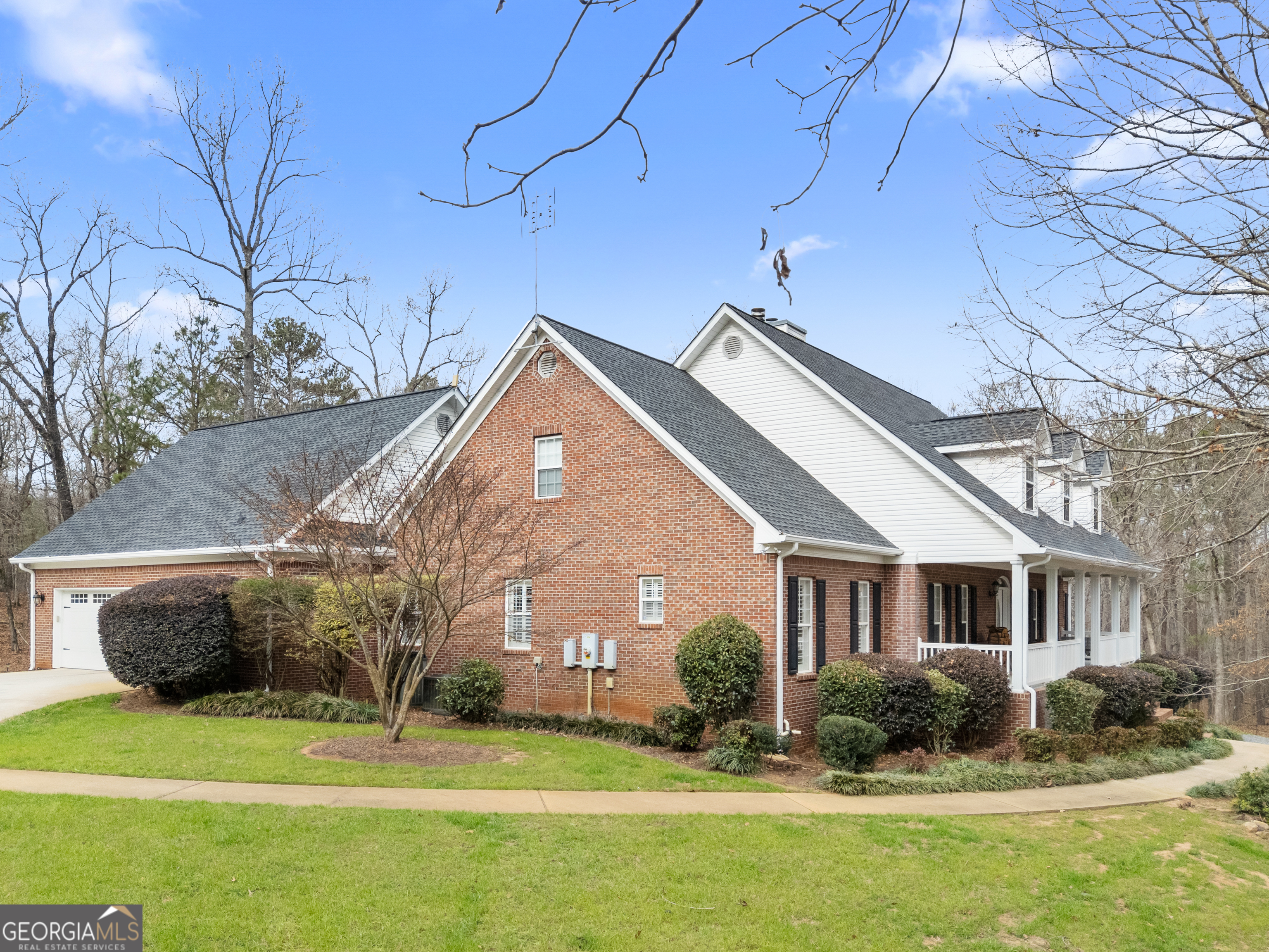 414 Parker Branch Road Barnesville, GA 30204 - Photo 6 of 101 a front view of a house with a garden