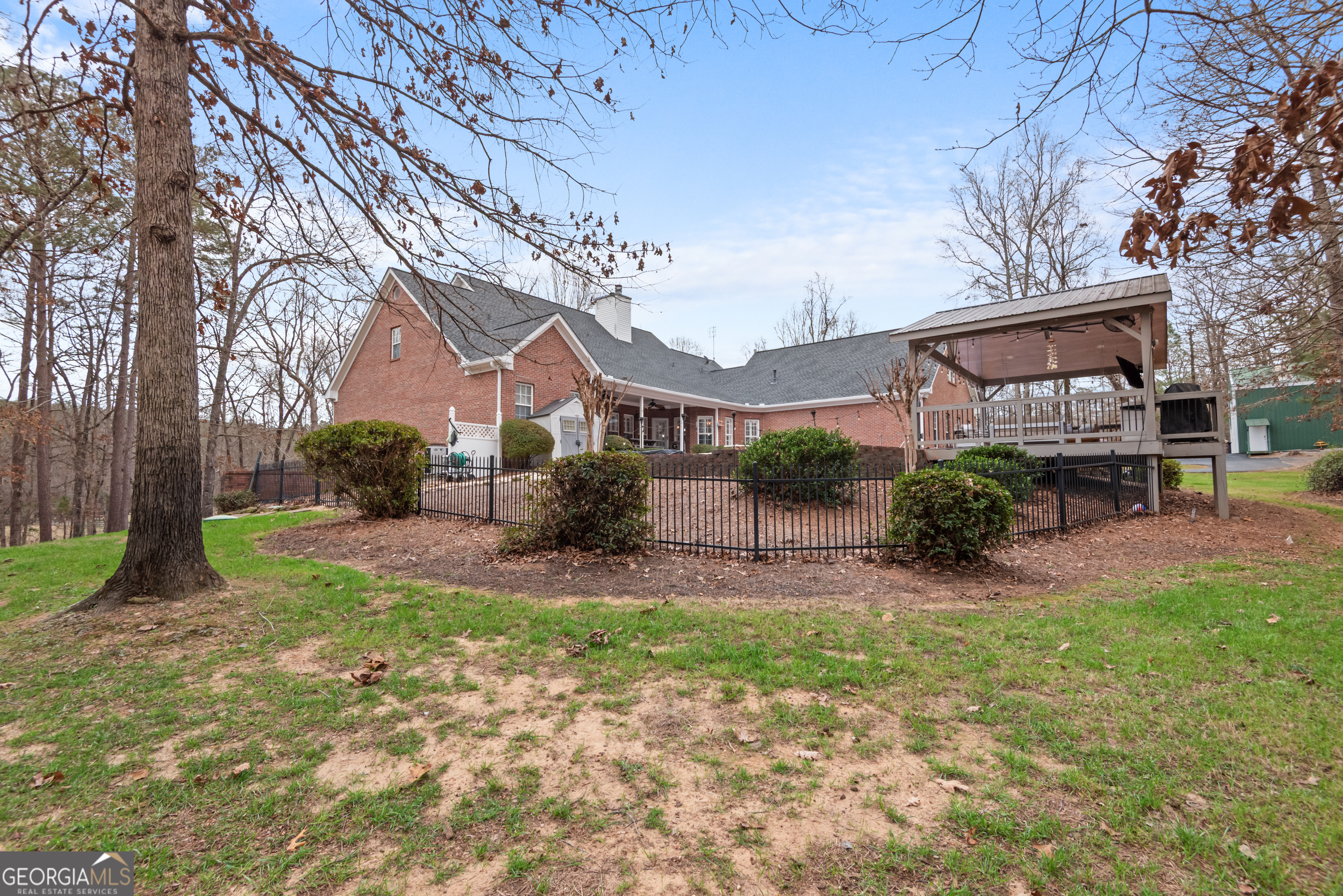 414 Parker Branch Road Barnesville, GA 30204 - Photo 72 of 101 a view of a house with a yard and table under an umbrella