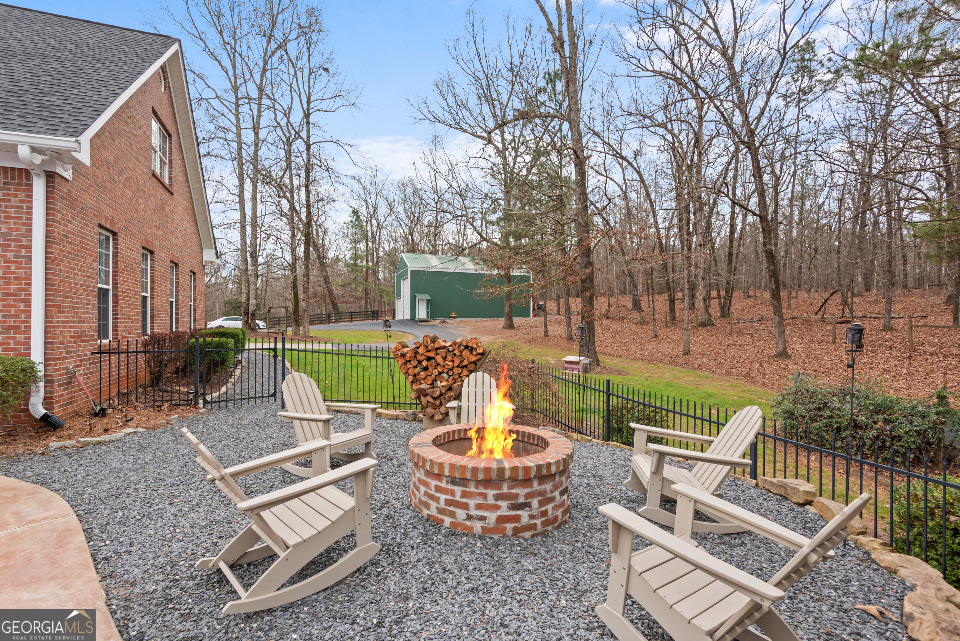 414 Parker Branch Road Barnesville, GA 30204 - Photo 82 of 101 a view of a patio with couches chairs and a fire pit