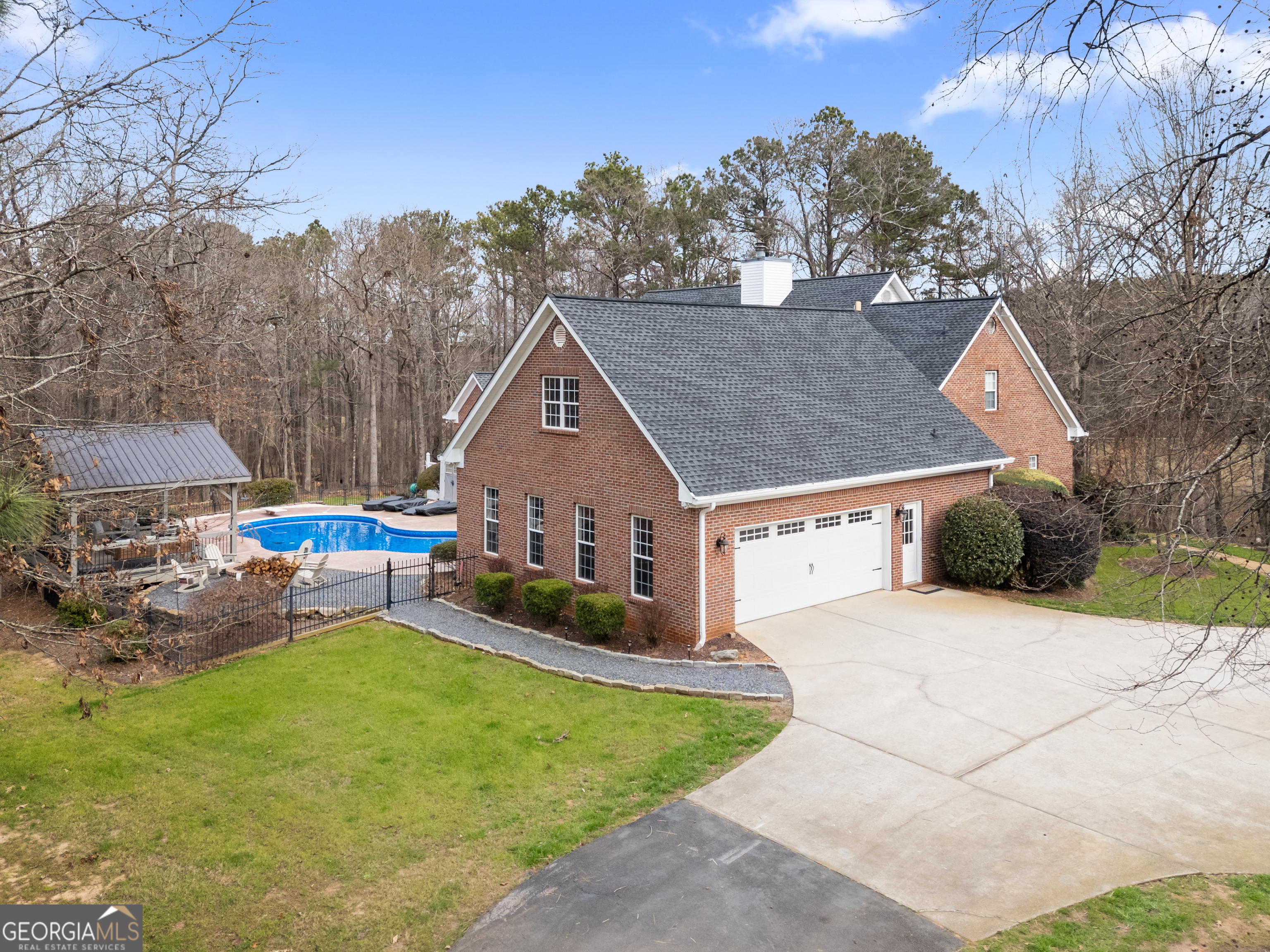 414 Parker Branch Road Barnesville, GA 30204 - Photo 83 of 101 a view of a house with backyard and sitting area