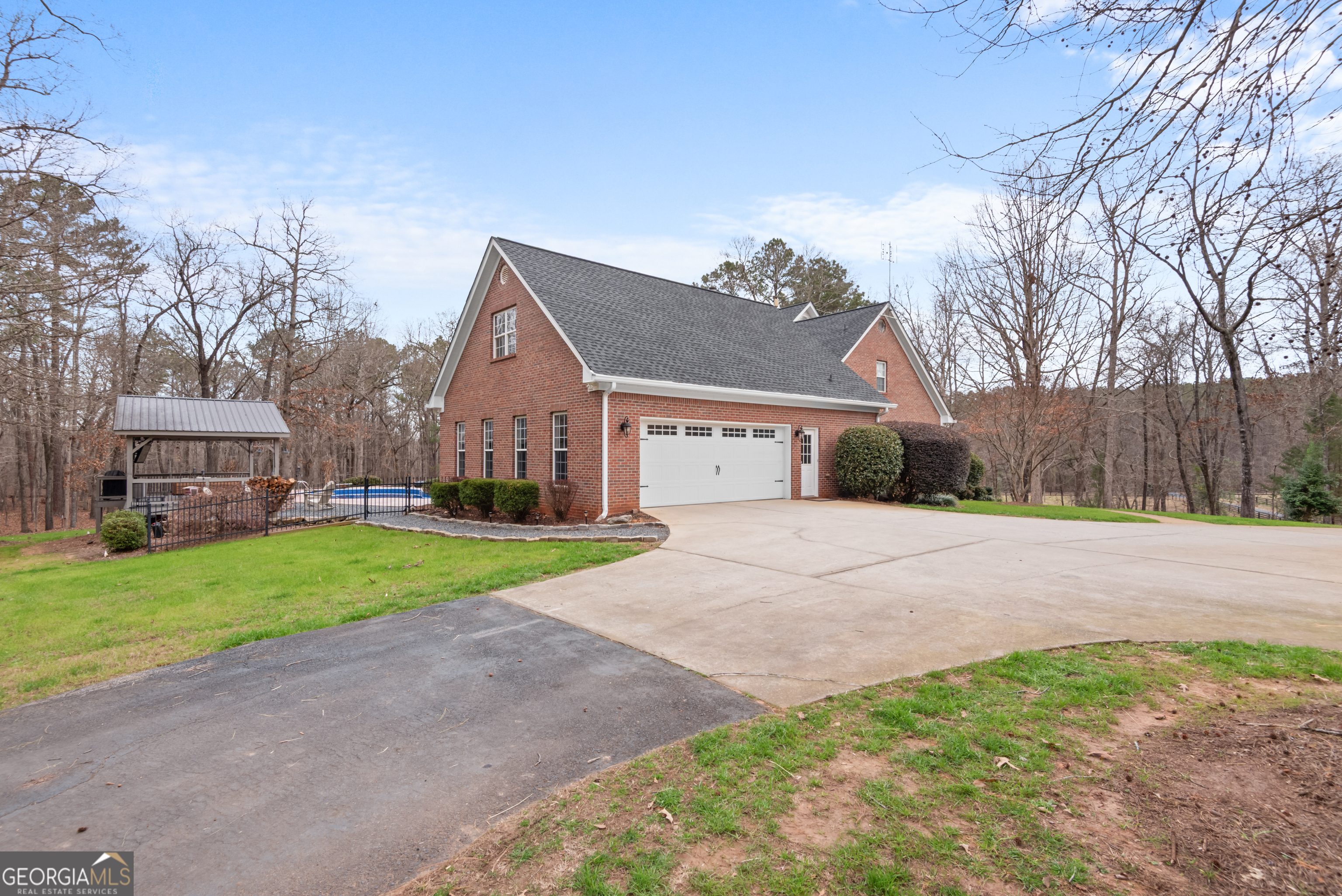 414 Parker Branch Road Barnesville, GA 30204 - Photo 84 of 101 a front view of a house with a yard and garage