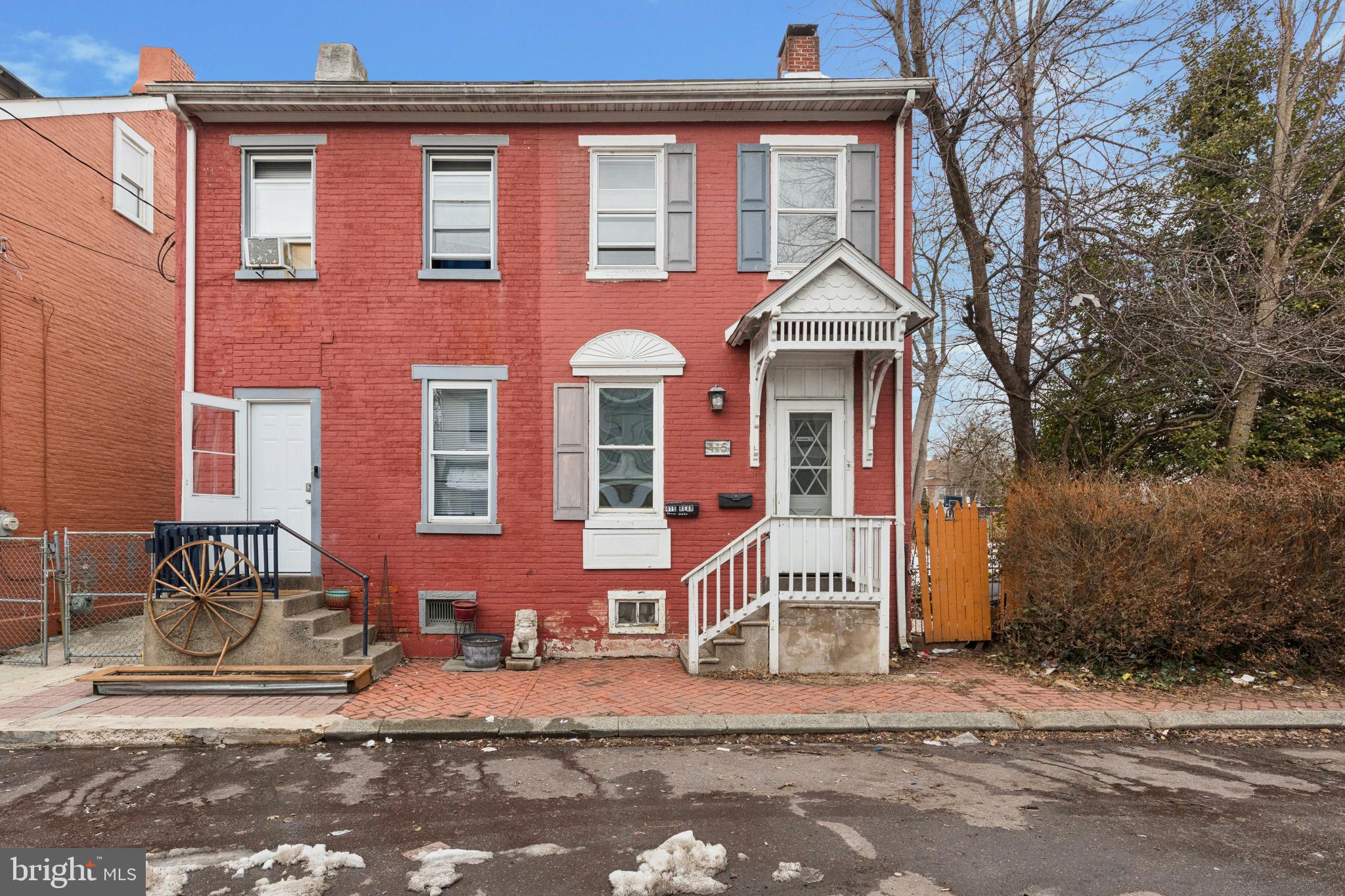 415 Walnut Street Pottstown, PA 19464 - Photo 1 of 15 a front view of a house with a yard