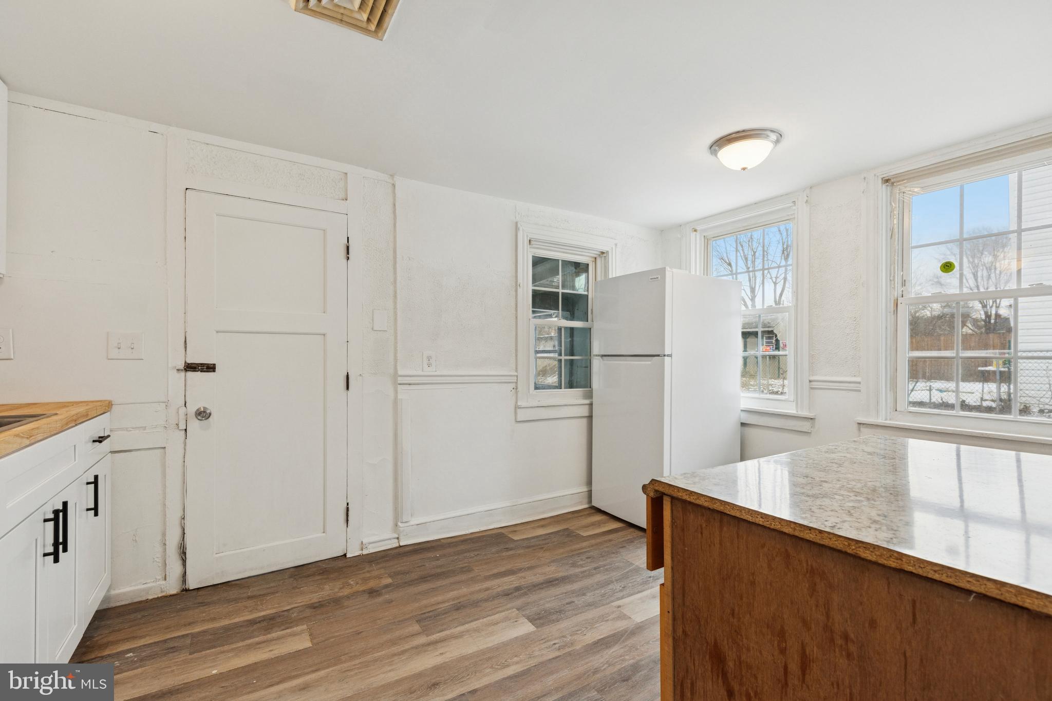 415 Walnut Street Pottstown, PA 19464 - Photo 7 of 15 wooden floor in an empty room with a window