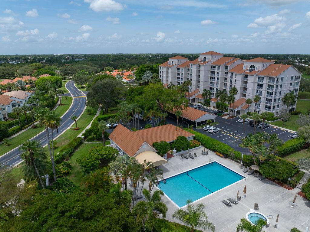 17031 Boca Club Boulevard, Unit 65A Boca Raton, FL 33487 - Photo 3 of 34 Aerial of Spyglass pool and Clubhouse