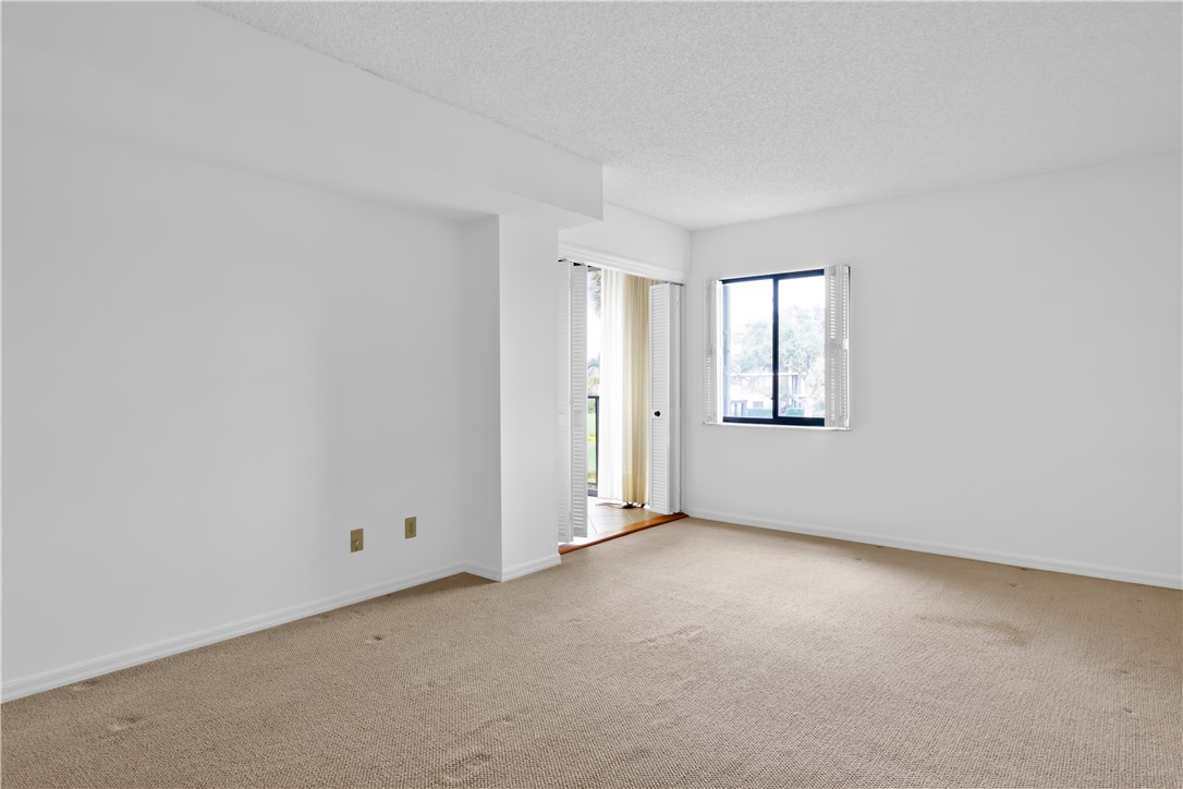 1850 Bay Road, Unit 2C Vero Beach, FL 32963 - Photo 16 of 36 an empty room with windows