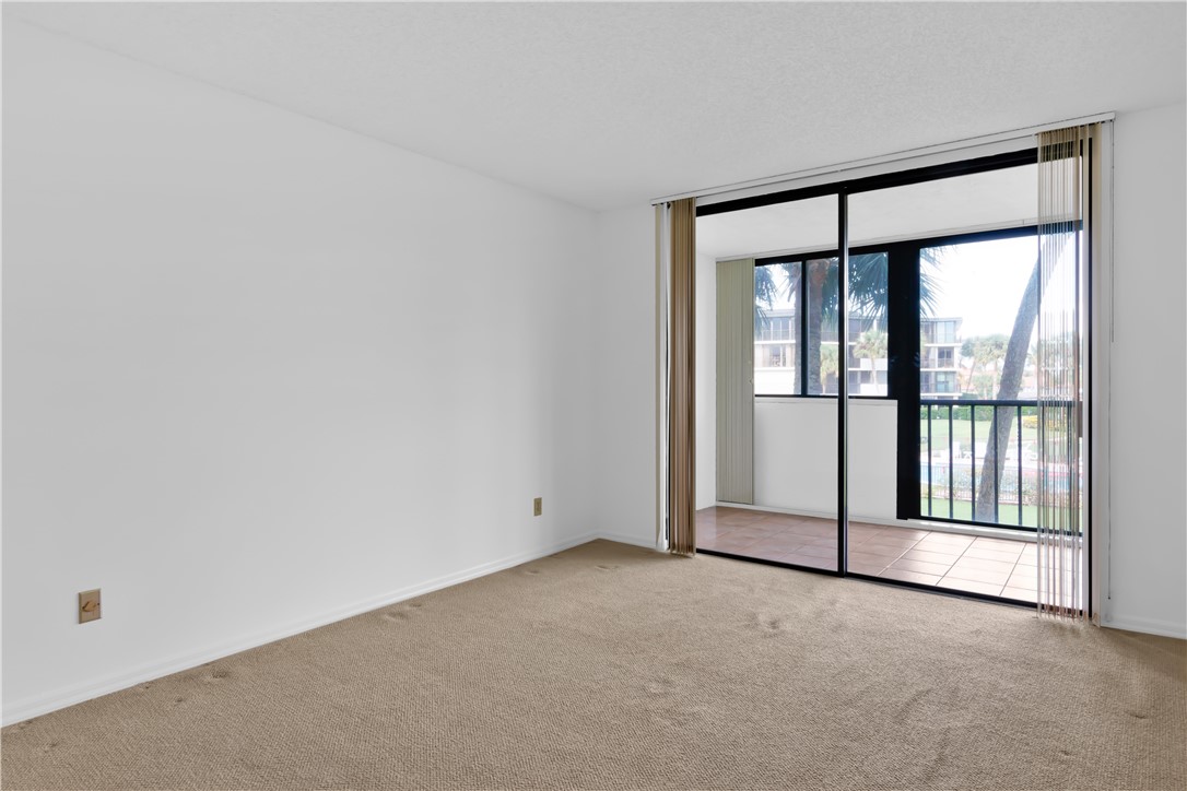1850 Bay Road, Unit 2C Vero Beach, FL 32963 - Photo 20 of 36 an empty room with a large window