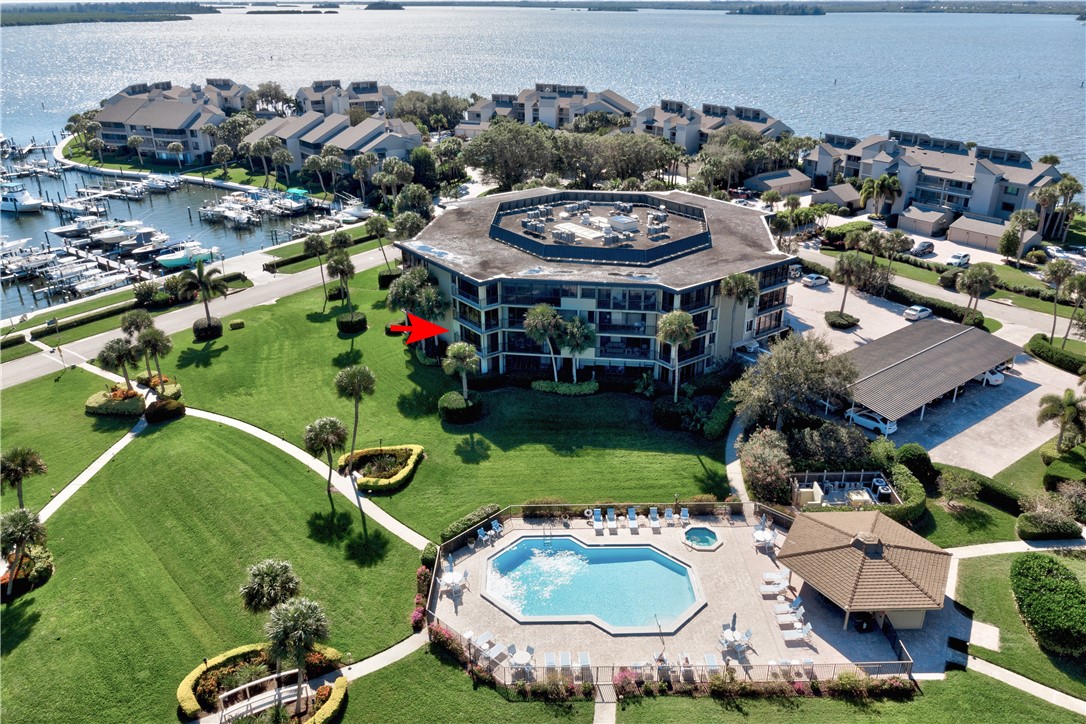 1850 Bay Road, Unit 2C Vero Beach, FL 32963 - Photo 2 of 36 an aerial view of a house swimming pool patio and outdoor seating