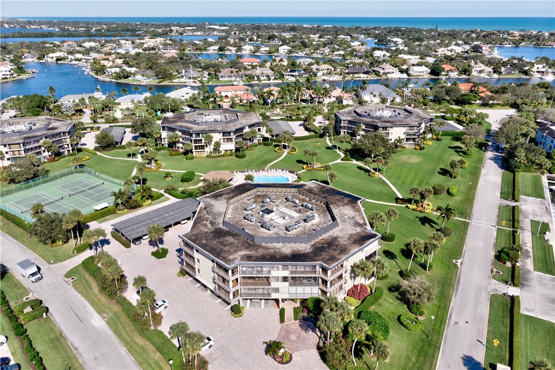 1850 Bay Road, Unit 2C Vero Beach, FL 32963 - Photo 32 of 36 an aerial view of a residential houses with outdoor space
