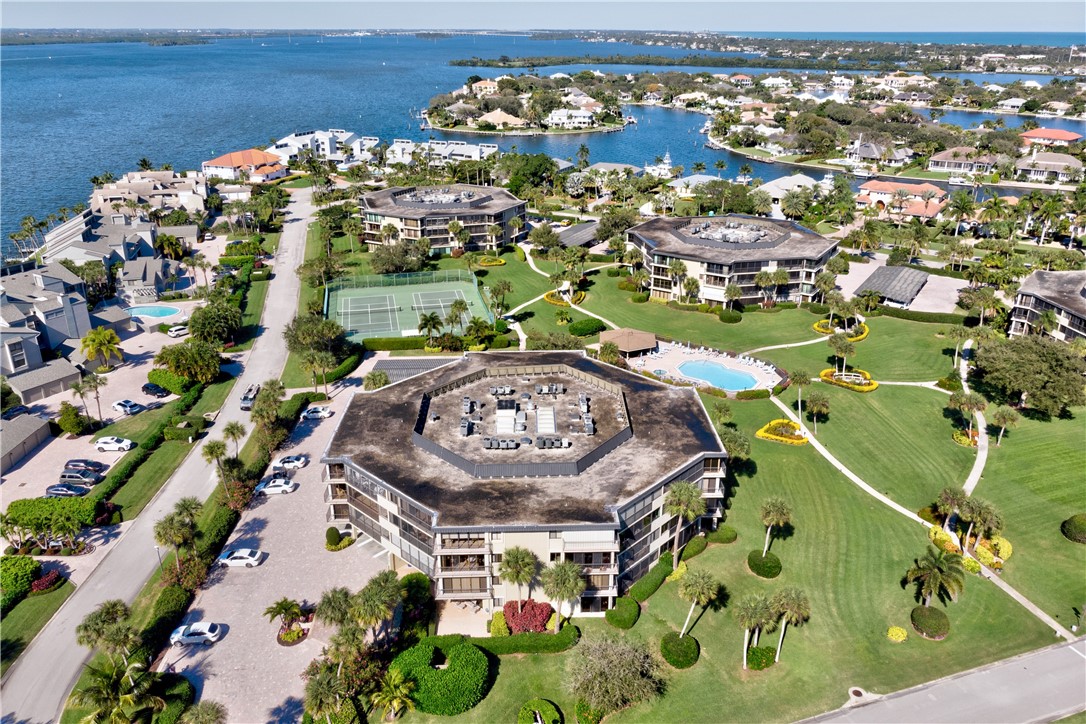 1850 Bay Road, Unit 2C Vero Beach, FL 32963 - Photo 33 of 36 an aerial view of a swimming pool patio swimming pool and outdoor seating
