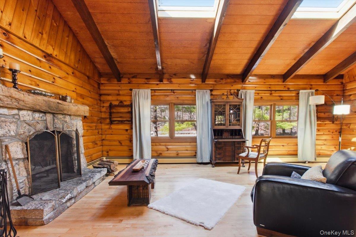 183 Bullet Hole Road Mahopac, NY 10541 - Photo 16 of 44 a living room with furniture and a fireplace