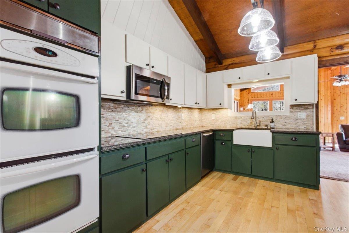 183 Bullet Hole Road Mahopac, NY 10541 - Photo 19 of 44 a kitchen with stainless steel appliances a stove sink and microwave