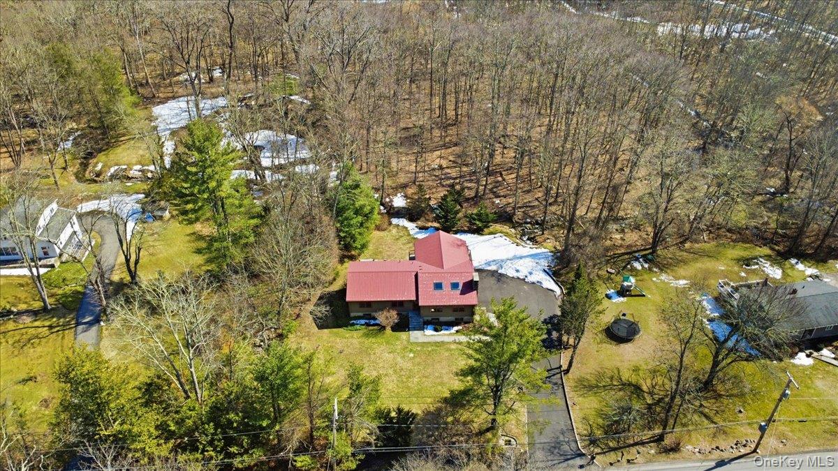 183 Bullet Hole Road Mahopac, NY 10541 - Photo 2 of 44 a aerial view of a residential apartment building with swimming pool and lawn chairs