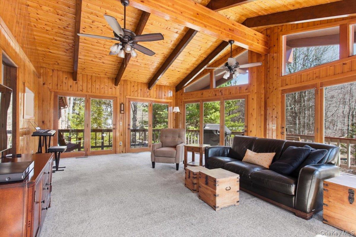 183 Bullet Hole Road Mahopac, NY 10541 - Photo 23 of 44 a living room with furniture ceiling fan and a large window