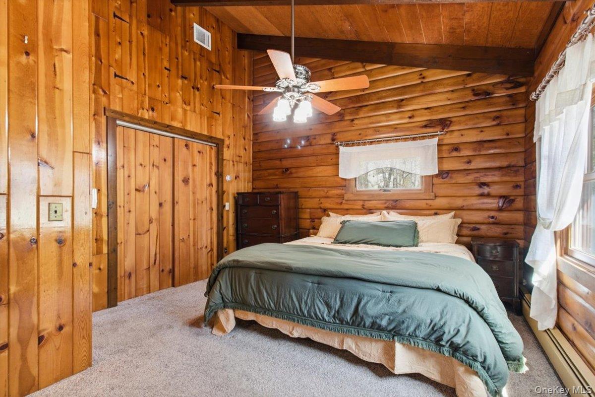 183 Bullet Hole Road Mahopac, NY 10541 - Photo 30 of 44 a bedroom with a bed and a table