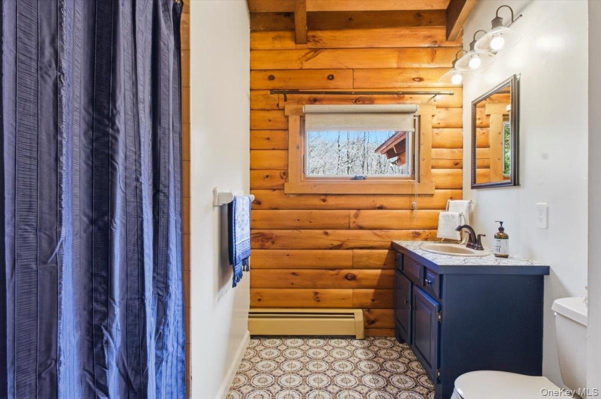 183 Bullet Hole Road Mahopac, NY 10541 - Photo 32 of 44 a bathroom with a sink and a mirror