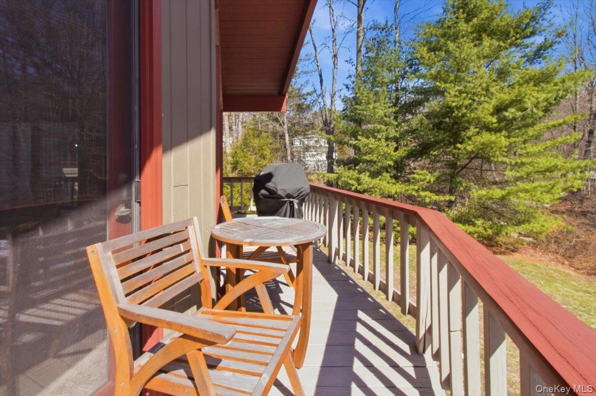 183 Bullet Hole Road Mahopac, NY 10541 - Photo 33 of 44 a view of balcony with wooden floor and outdoor seating