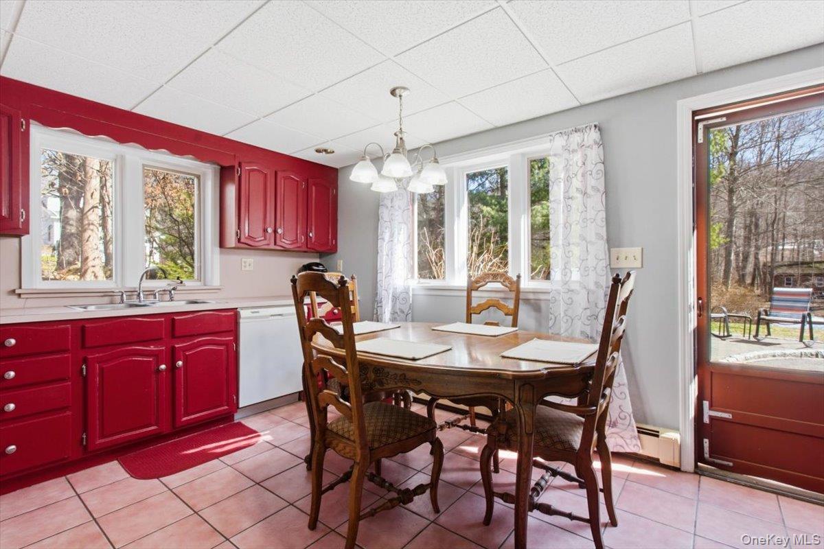 183 Bullet Hole Road Mahopac, NY 10541 - Photo 40 of 44 a view of a dining room with furniture window and outside view