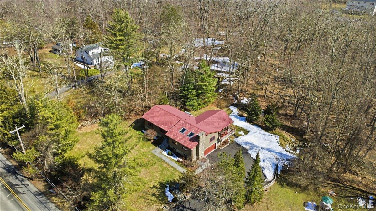 183 Bullet Hole Road Mahopac, NY 10541 - Photo 5 of 44 an aerial view of a house with swimming pool