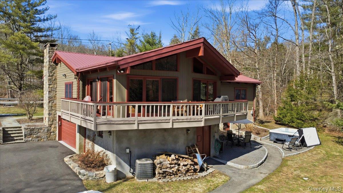 183 Bullet Hole Road Mahopac, NY 10541 - Photo 7 of 44 a view of a house with a deck and a yard