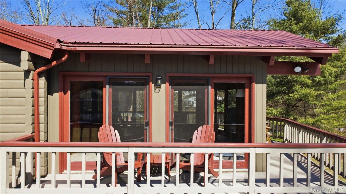 183 Bullet Hole Road Mahopac, NY 10541 - Photo 10 of 44 a view of a small house with large window and wooden fence