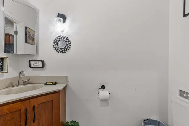 a bathroom with a sink and vanity